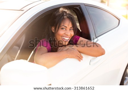 Attractive woman and her white car