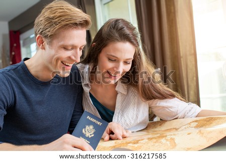 Young couple planning a trip together