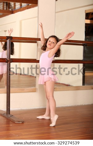 Young little girl ballet dancing