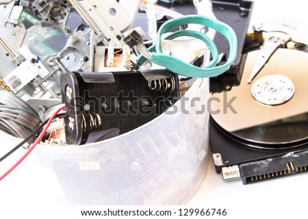 Small heap of mixed electronic waste.