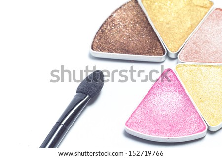 Multi colored make-up eye shadow and brush