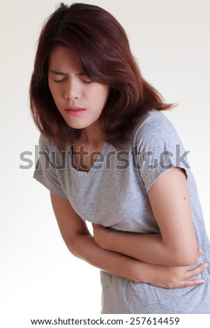 Woman with both palm around waistline to show pain and injury on belly area and stomach ache. Medical health care concept.