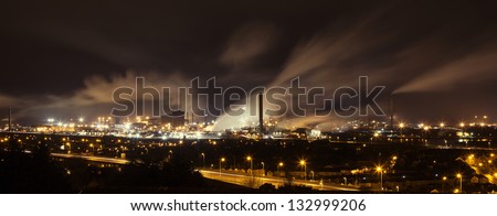 Night view across Port Talbot industrial steelworks and factories in South Wales