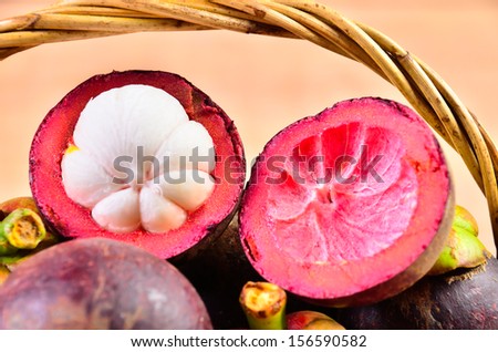 Mangosteen Fresh fruit in a basket on a wooden floor