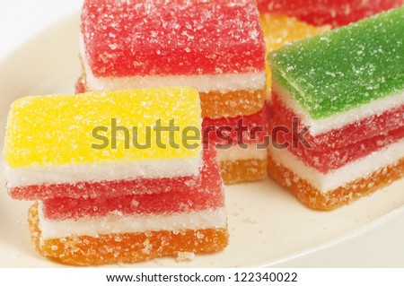 Different fruit-paste candies on a small plate