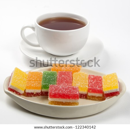 fruit-paste candies and a cup of tea