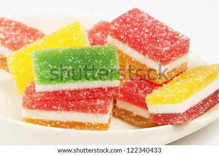 Different fruit-paste candies on a small plate