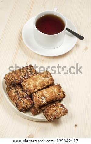 Cakes with jam and a cup of tea