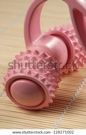 Plastic roll masseur tool, close-up shot