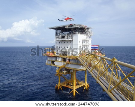 GULF OF THAILAND,THAILAND- JULY 31 12: Helicopter landing at offshore petroleum production platform. Offshore platform located in gulf of Thailand on July 31, 2012.