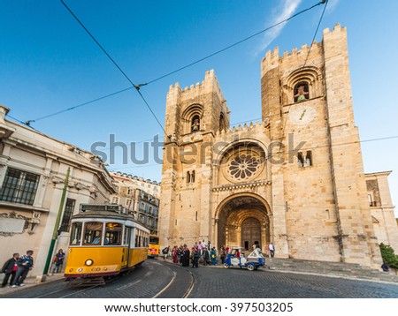 Se (Lisbon Cathedral) with a traditional yellow tram in Lisbon, Portugal