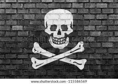 Pirate flag on a brick wall