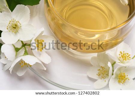 Jasmine tea and Jasmine flowers on a white background