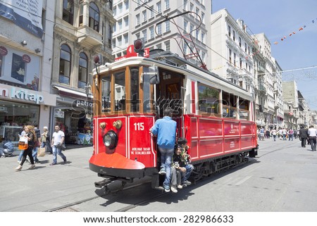ISTANBUL, TURKEY - MAY 15, 2015: Vintage tram on the Taksim Street in Istanbul, Turkey. Nostalgic tram of Istanbul is the heritage tramway system. It was re-established in 1990.