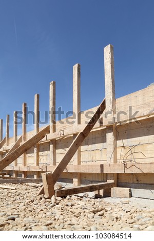 Wooden form work for concrete wall at construction site