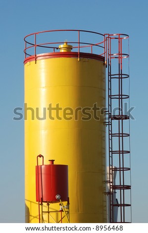 Yellow tank in refinery or factory