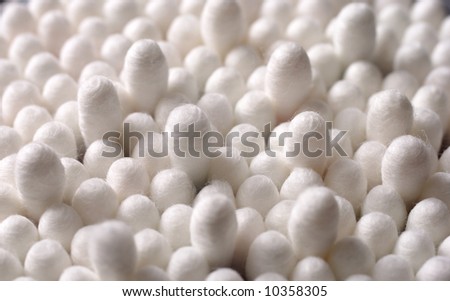 Heap of white cotton sticks in close up