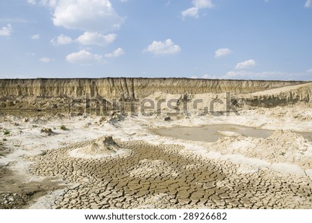 Yellow clay in moor with dry land blue sky and  clouds