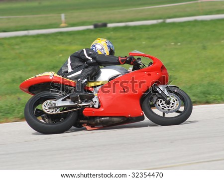 Motorcycle races, red motorcycle in full speed