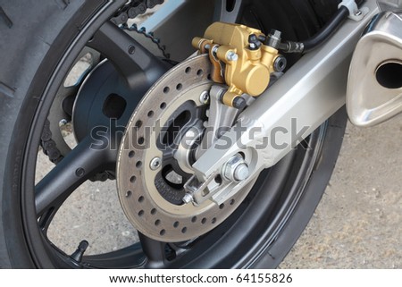 Motorcycle disk brakes and tire in close up