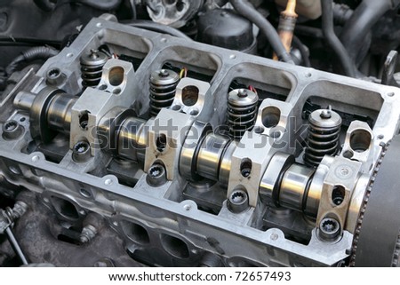 Repairing of modern diesel engine closeup of camshaft and valves