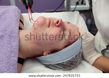 Beauty treatment of face skin with high frequency infrared spot remover  in SPA center