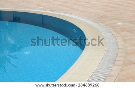 Detail from open air swimming pool with clean blue water