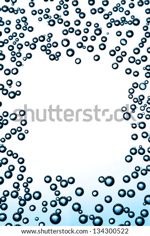 Gradient background with frame of bubbles on a glass.