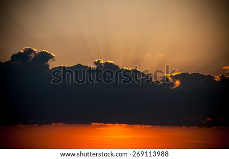 Sofia, Bulgaria - 13 April, 2015: Outdoor crepuscular sun rays of volumetric light of a cloudy dark vivid sunset over the residential district of Gorna Banya in the west of Sofia