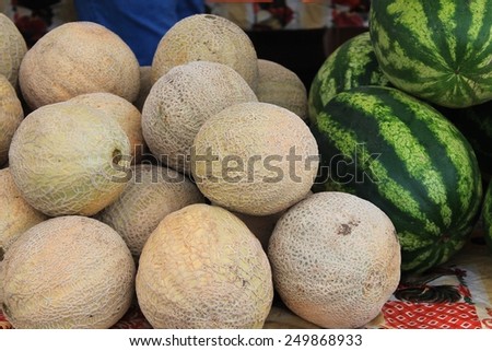 Cantaloupe and watermelons for sale at a farmer\'s market in the Pacific Northwest