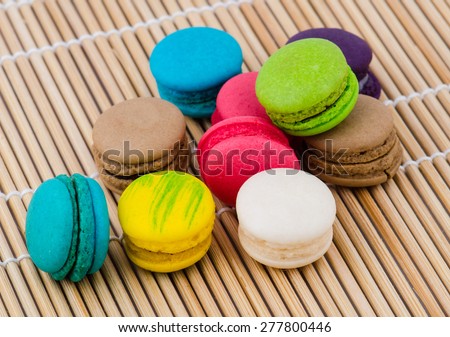 Colorful macarons on a bamboo floor