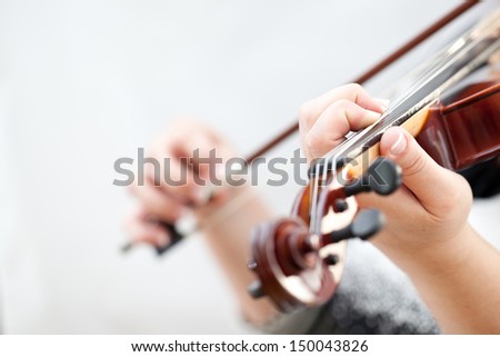 Musician playing violin isolated on white
