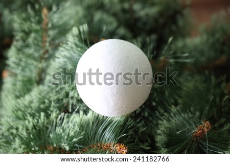 White ball on the Christmas tree