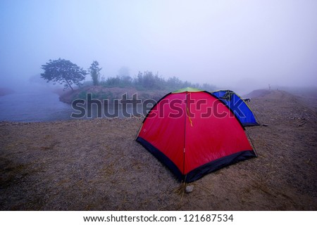 Tent camping near river , North Thailand