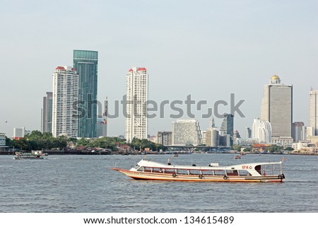 BANGKOK - APRIL 04: Taxi boats transporting passengers on April 04, 2013 in Bangkok, Thailand. Chao Phraya river is a waterway for both cargo and passenger transport for the city.