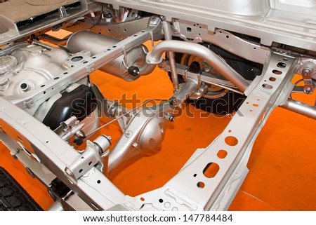 Car chassis with engine. Image of car chassis with engine