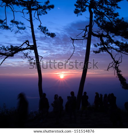 Photographer shooting in sunset environment at phu kra dueng at Thailand national park.
