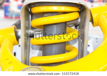 Yellow shock absorber car