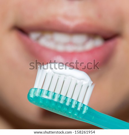 Beautiful woman with toothbrush. Dental care background