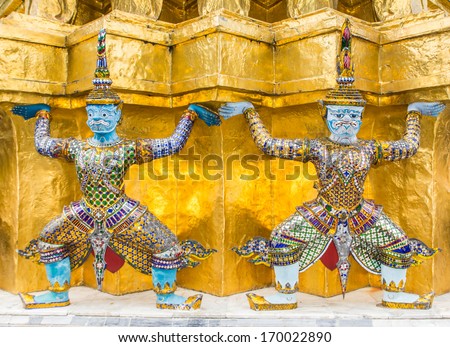 Giant Buddha in Wat Phra Kaeo, Temple of the Emerald Buddha and the home of the Thai King. Wat Phra Kaeo is one of Bangkok\'s most famous tourist sites and it was built in 1782 at Bangkok, Thailand.