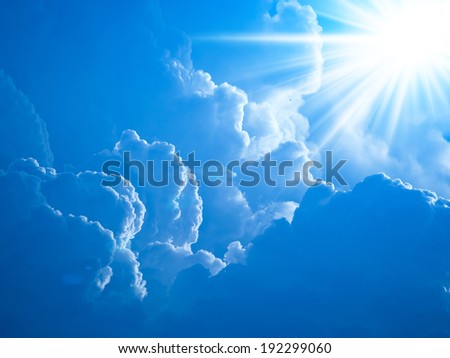 Realistic shining sun with lens flare. Blue sky with clouds back