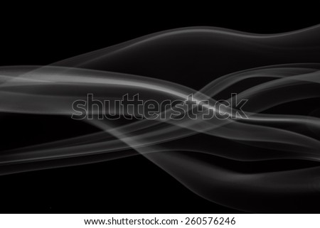 Photograph of abstract smoke with led light screen on black background