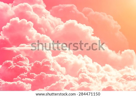 Pink red clouds on sky background