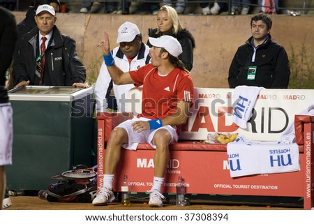 RANCAGUA, CHILE - SEPTEMBER 18: Nicolas Massu of Chile argues with the referee in the match against Jurgen Melzer of Austria during the Davis Cup on September 18, 2009 in Chile.