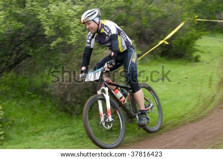 SANTIAGO, CHILE - SEPTEMBER 27: Rider number 133 goes downhill on Alpes Cup, mountain bike competition on September 27, 2009 in Santiago, Chile.
