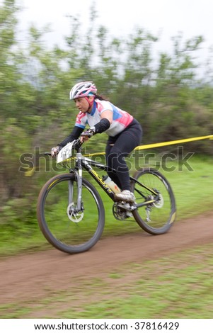 SANTIAGO, CHILE - SEPTEMBER 27: Rider number 195 goes downhill on Alpes Cup, mountain bike competition on September 27, 2009 in Santiago, Chile.