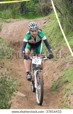 SANTIAGO, CHILE - SEPTEMBER 27: Rider number 37 goes downhill on Alpes Cup, mountain bike competition on September 27, 2009 in Santiago, Chile.