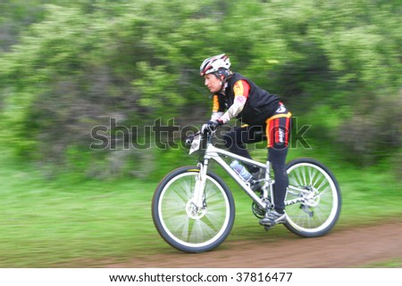 SANTIAGO, CHILE - SEPTEMBER 27: Rider number 1-191 goes downhill on Alpes Cup, mountain bike competition on September 27, 2009 in Santiago, Chile.
