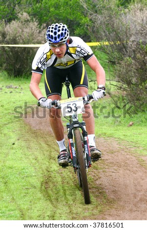 SANTIAGO, CHILE - SEPTEMBER 27: Rider number 53 goes downhill on Alpes Cup, mountain bike competition on September 27, 2009 in Santiago, Chile.