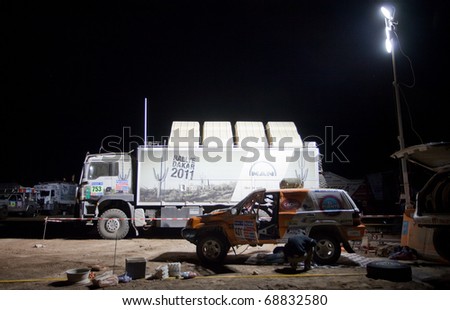 COPIAPO - JANUARY 11: Eduardo Delamano from Argentina repais his car during the night before the Copiapo\'s Stage of Rally Dakar 2011 Argentina Chile, January 11 in Copiapo Chile.